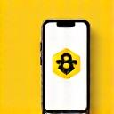 Logotyp aplikacji Bumble na ekranie smartfona, z ikoną ula i pszczoły, symbolizującą empowerment kobiet.